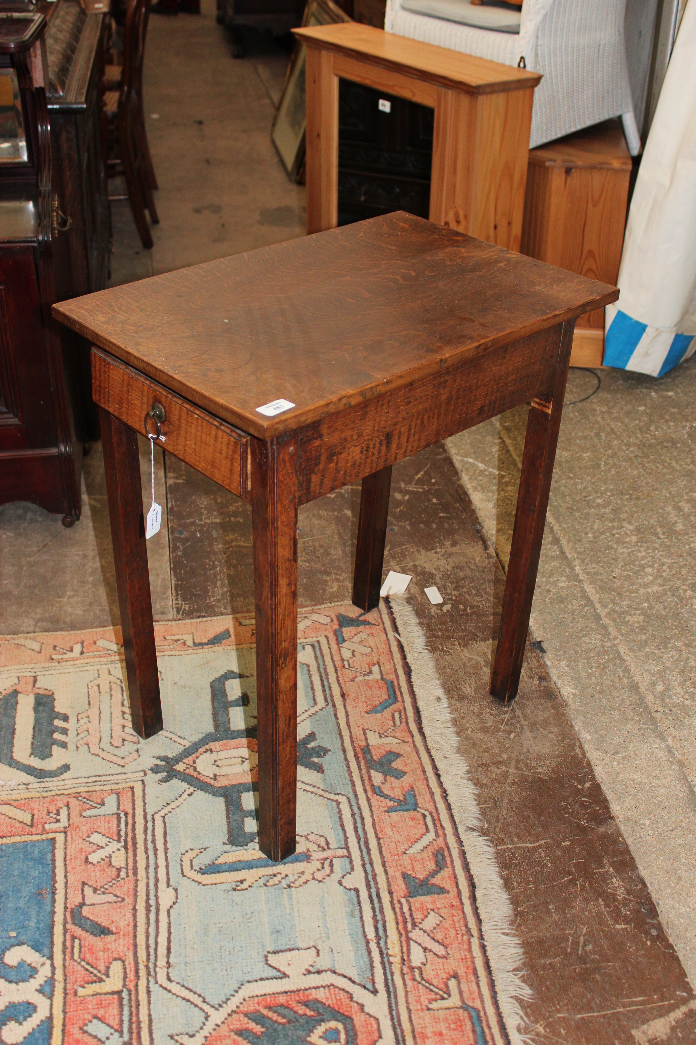 AN EARLY 19TH CENTURY OAK RECTANGULAR TOP SIDE TABLE with two short drawers at either end and