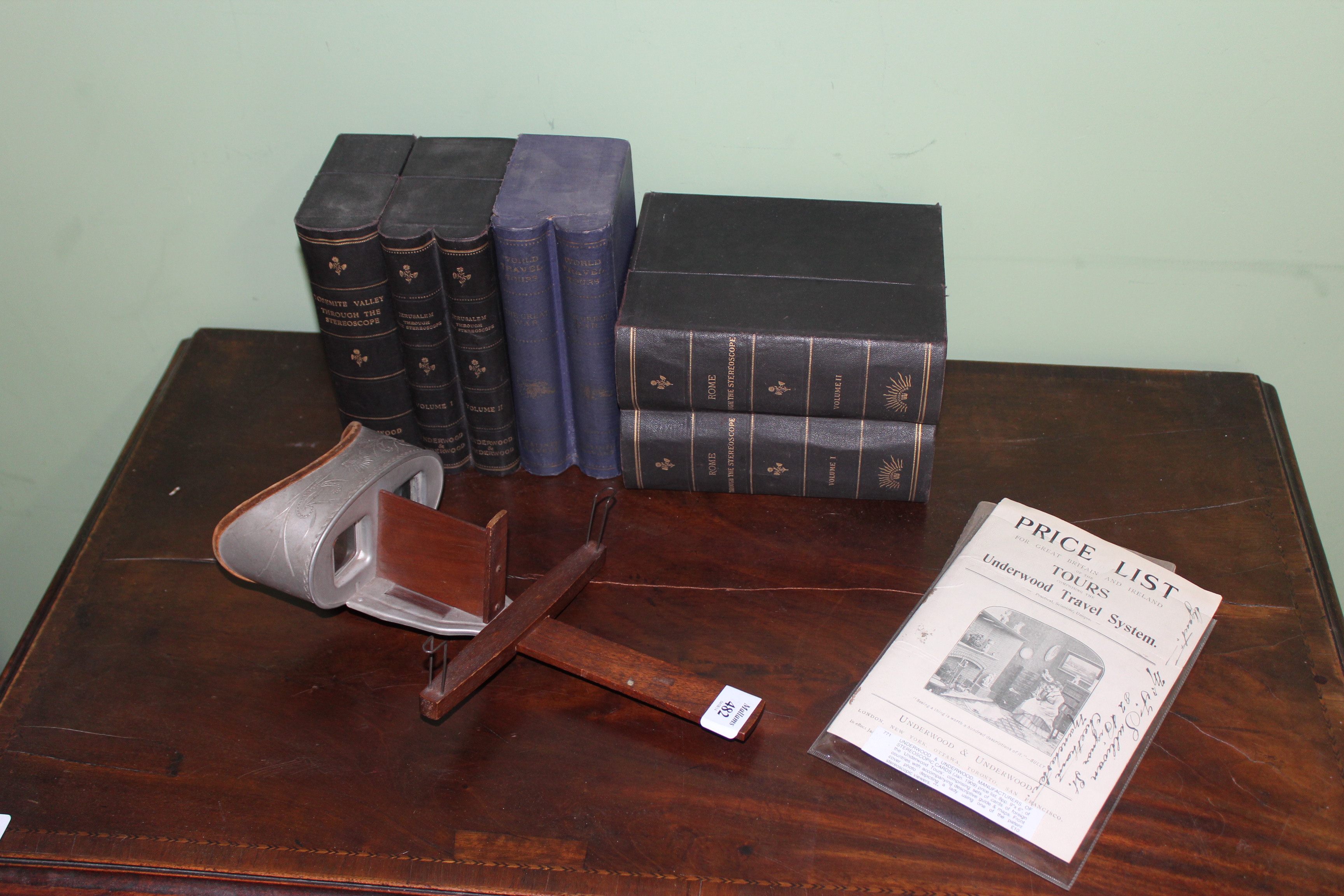 AN UNDERWOOD AND UNDERWOOD STEREOSCOPIC SLIDE VIEWER together with a collection of slides to