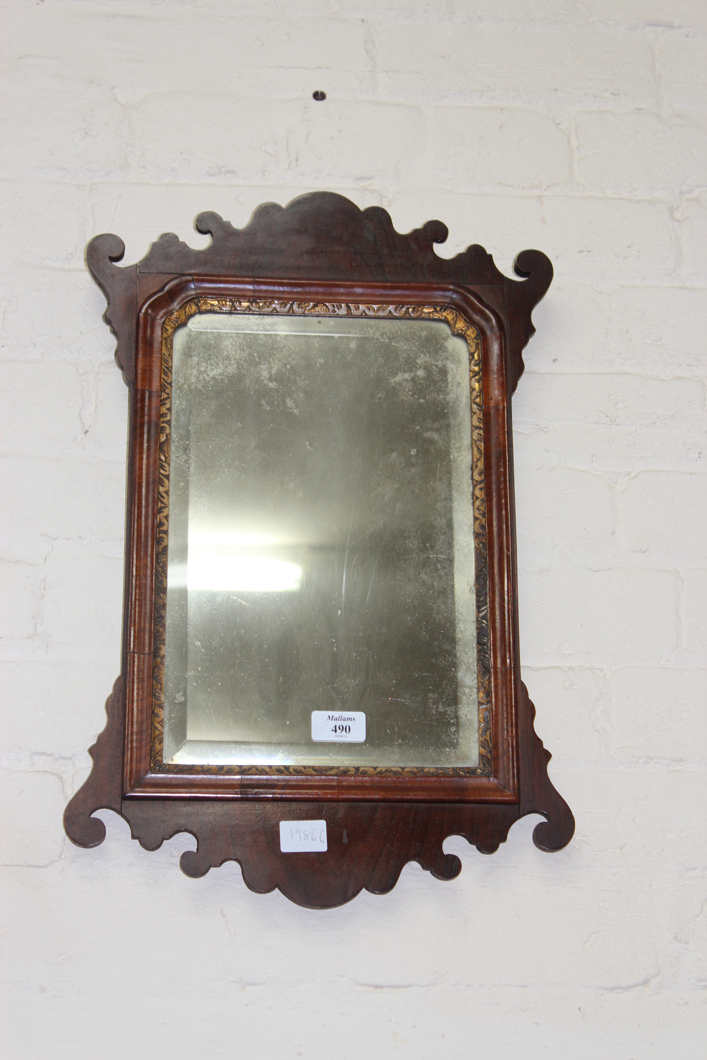 A 19TH CENTURY FRET FRAMED WALL MIRROR, 56cm in height