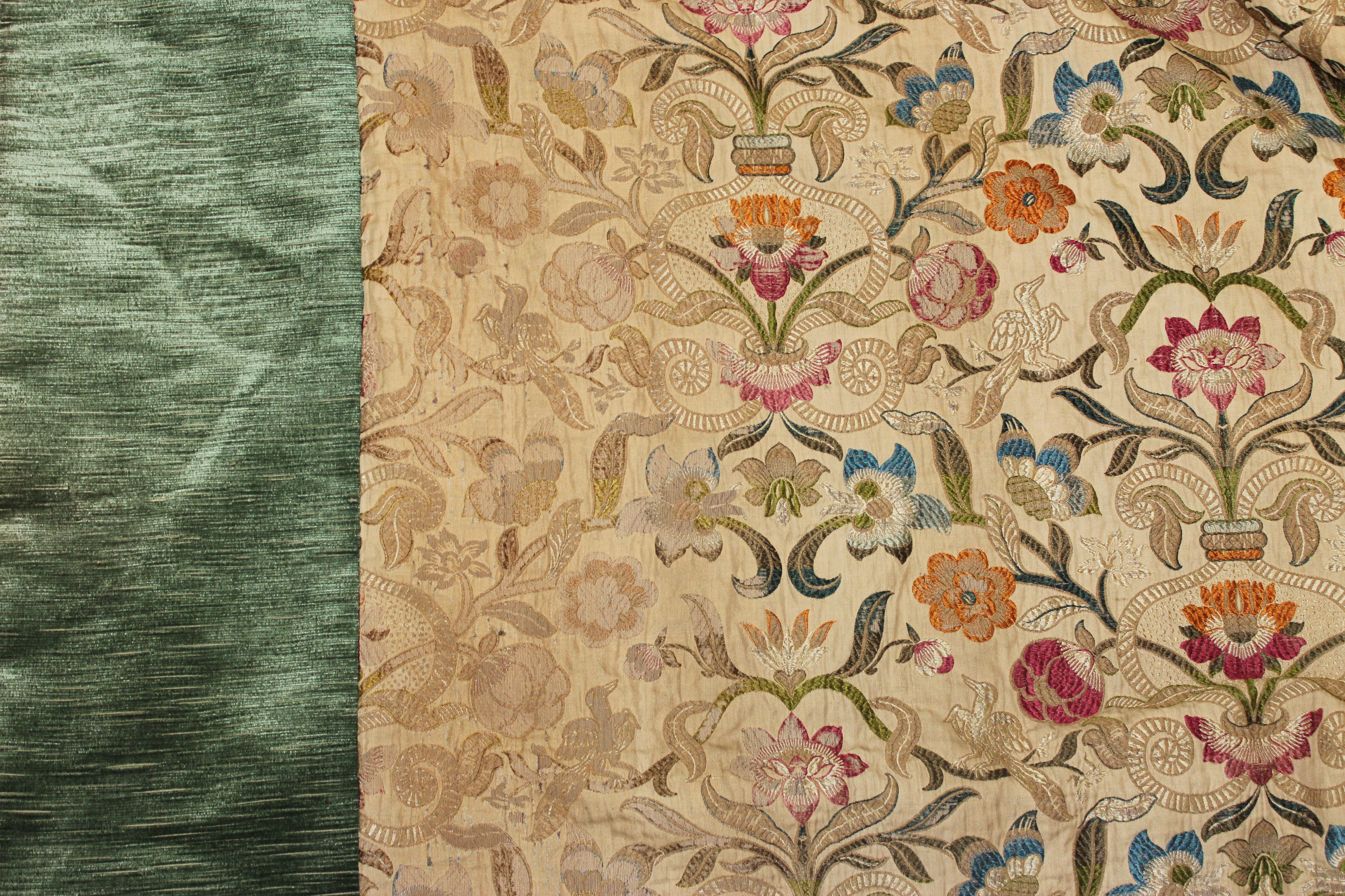 A SET OF FOUR PAIRS OF 17TH CENTURY FLEMISH STYLE CURTAINS with polychrome needlework bird and