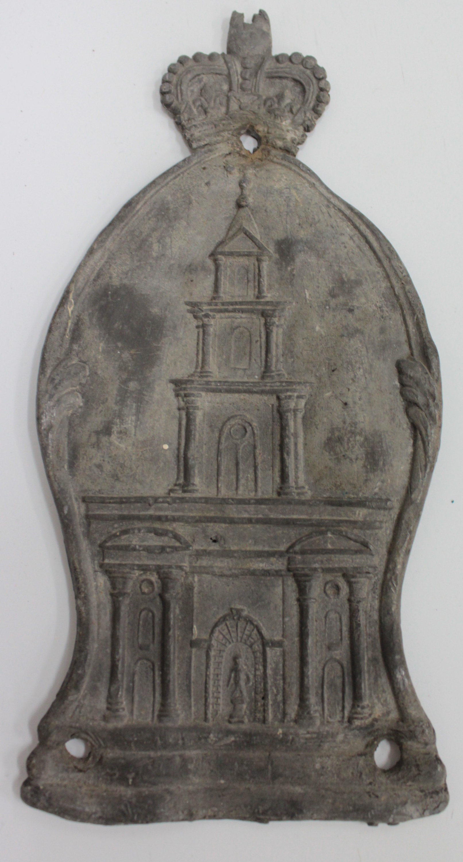 AN OLD LEAD PLAQUE possibly a fire mark with crown top and tiered classical building beneath, 22cm