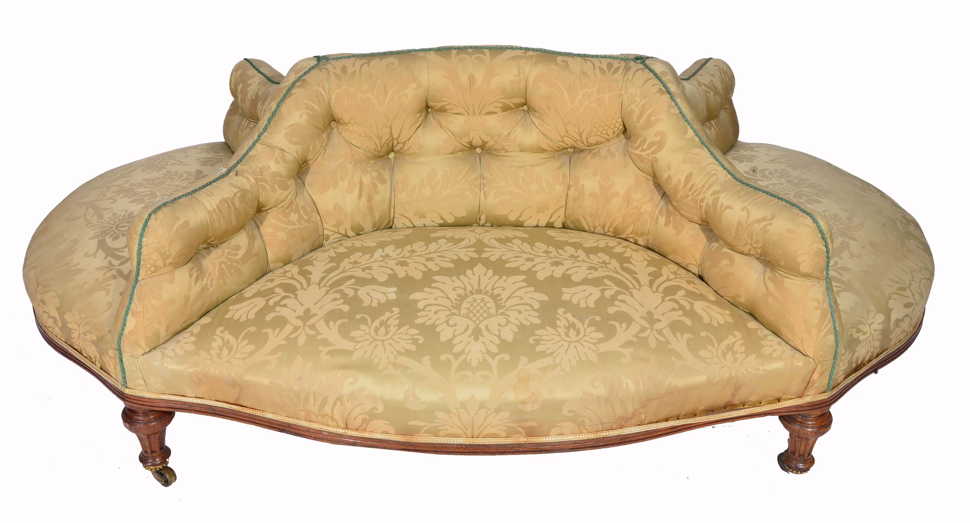 A HOLLAND & SONS WALNUT FRAMED FOUR SEATER CONVERSATION SEAT upholstered in pale green material and