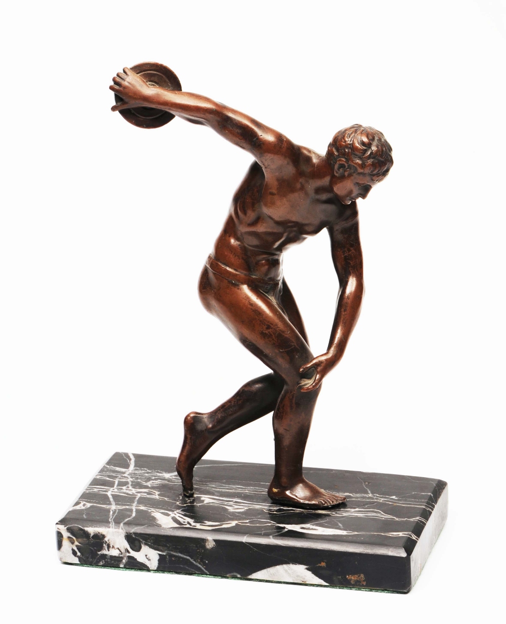 A BRONZED SCULPTURE of a discus thrower, mounted on a rectangular marble base, 22cm high overall