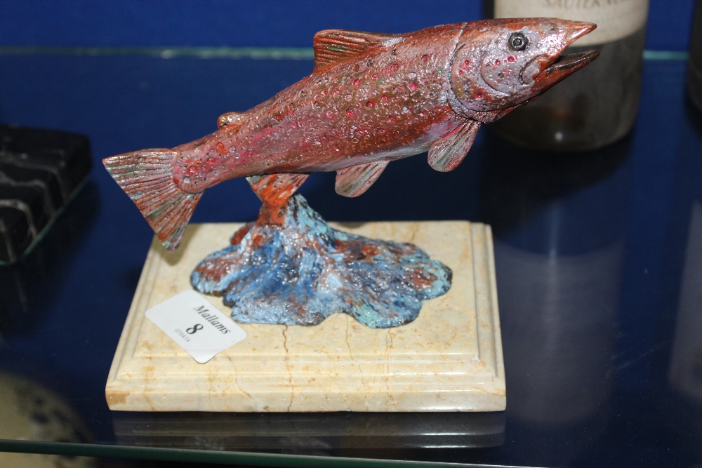 A COLD PAINTED CAST METAL SCULPTURE of a leaping salmon, mounted on a stepped base, the salmon