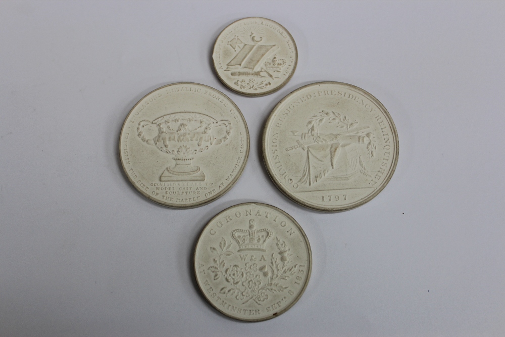 FOUR PLASTER CASTS OF MEDALLIONS the largest 5cm in diameter