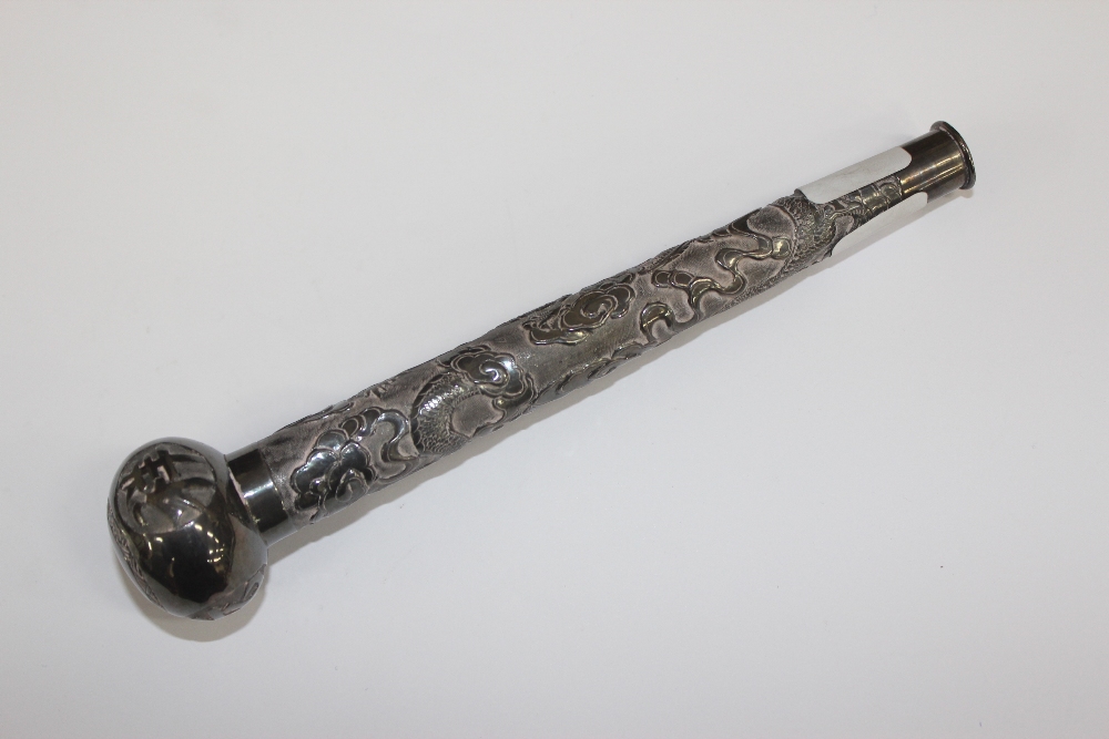 AN ORIENTAL WHITE METAL PARASOL HANDLE illustrated in relief with dragons with Chinese characters to