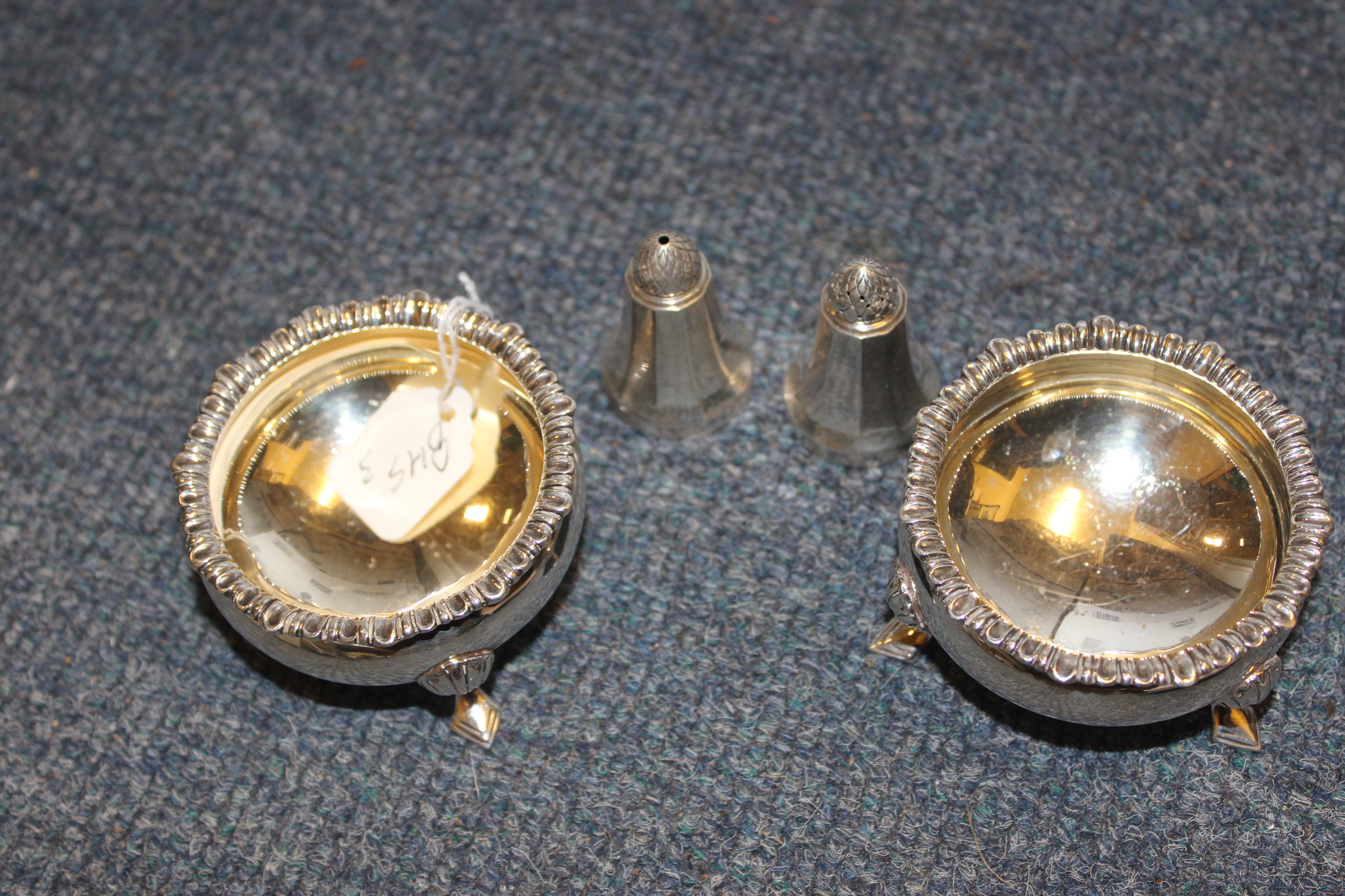 A PAIR OF SILVER SALTS marks for Birmingham 1922 and a picnic silver salt and pepper by George