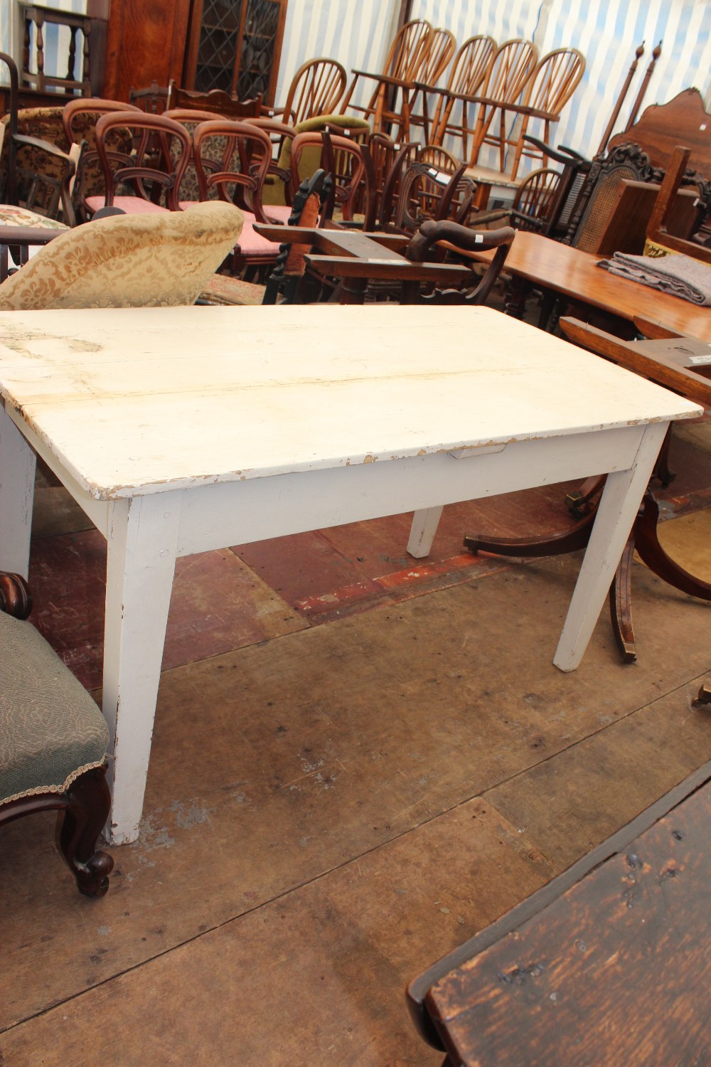 AN OLD PINE KITCHEN TABLE with pegged construction, square tapering legs, single drawer, painted