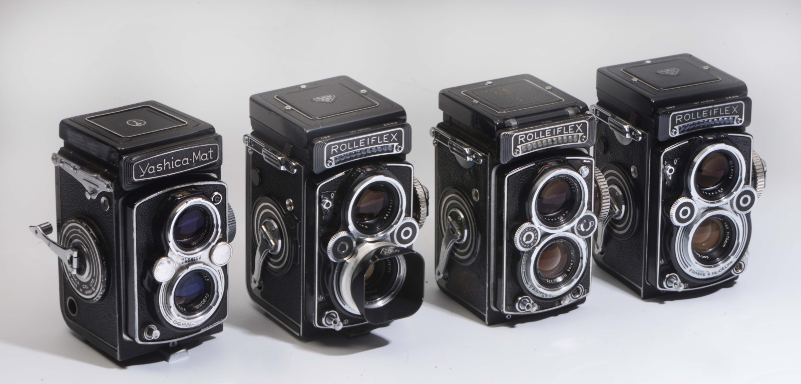 A FRANKE & HEIDECKE ROLLIFLEX TWIN LENS CAMERA in original leather case together with two further