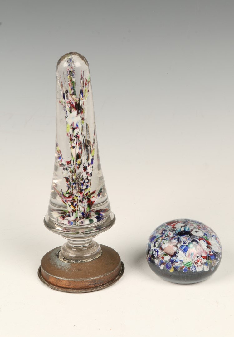 A MILLEFIORI GLASS WIG STAND standing on a bronzed turned foot, 19cm high and a millefiori glass