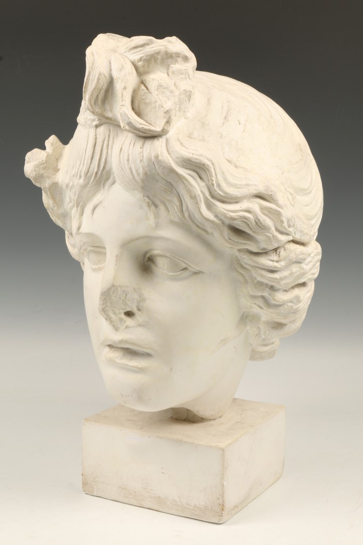 AN OLD PLASTER BUST after the Antique on a square base, 45cm high