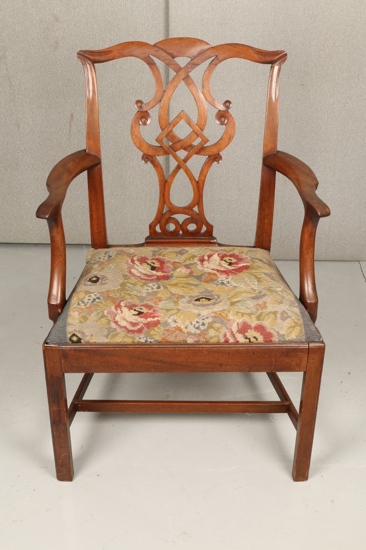 A GEORGE III MAHOGANY ARMCHAIR with scroll splat back, needlework drop in seat and chamfered legs,