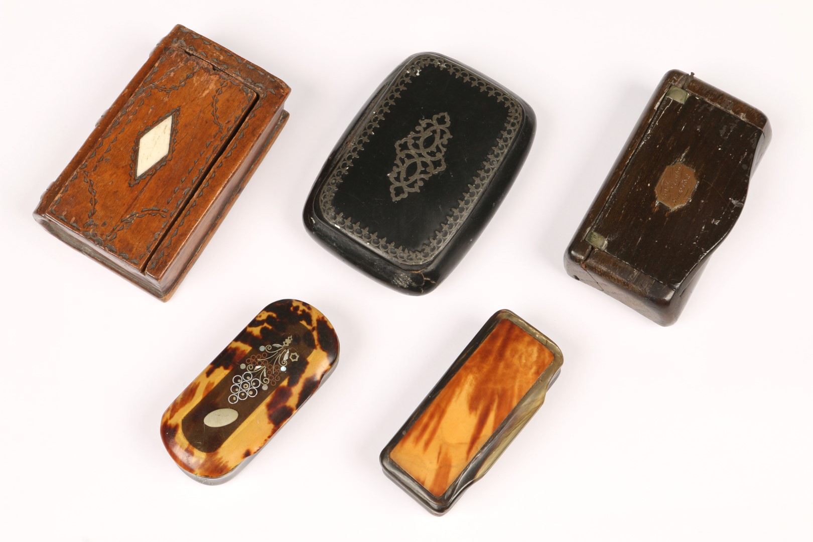 TWO HORN AND TORTOISESHELL SNUFF BOXES, one with inlaid flowers; one wooden snuff box in book form