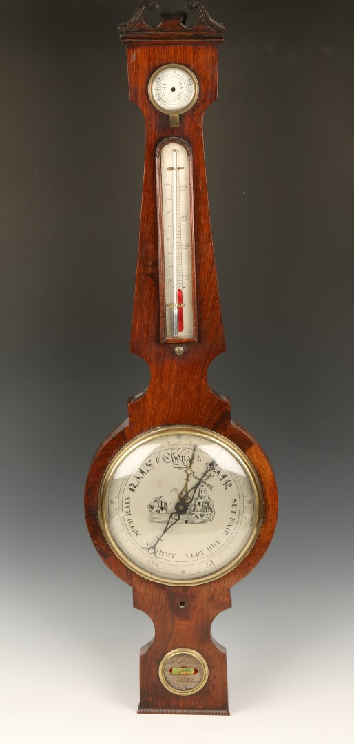 A VICTORIAN ROSEWOOD WHEEL BAROMETER with circular steel dial, thermometer, hygrometer and spirit