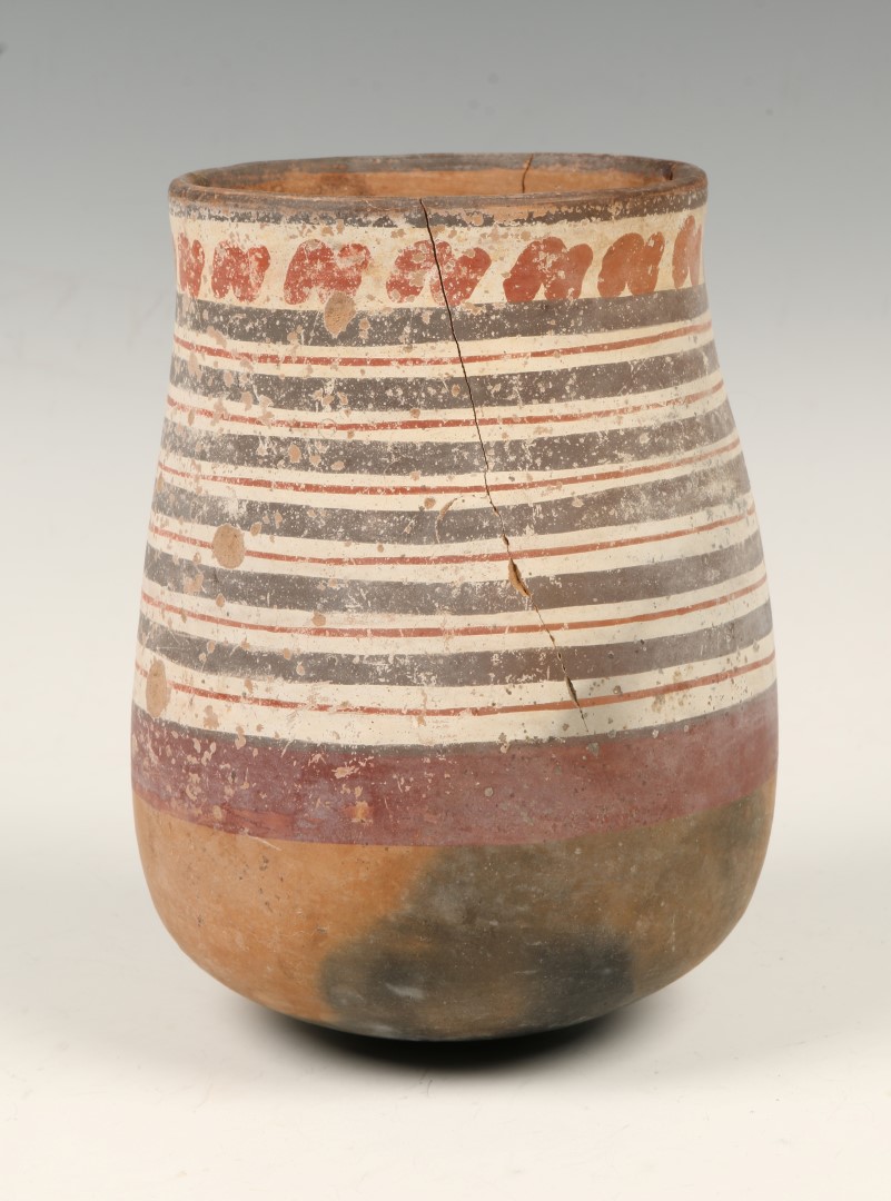 A VESSEL of rounded form painted in red and black with lines and dashes, late Tiahuanaco, c1000-