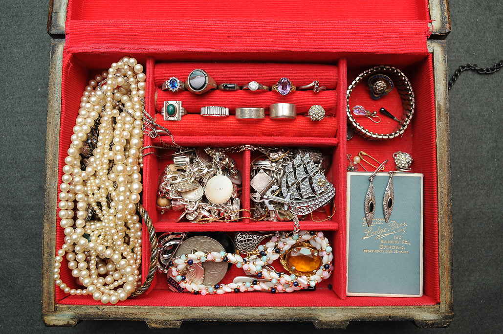 A BOX OF VARIOUS SILVER RINGS and costume jewellery