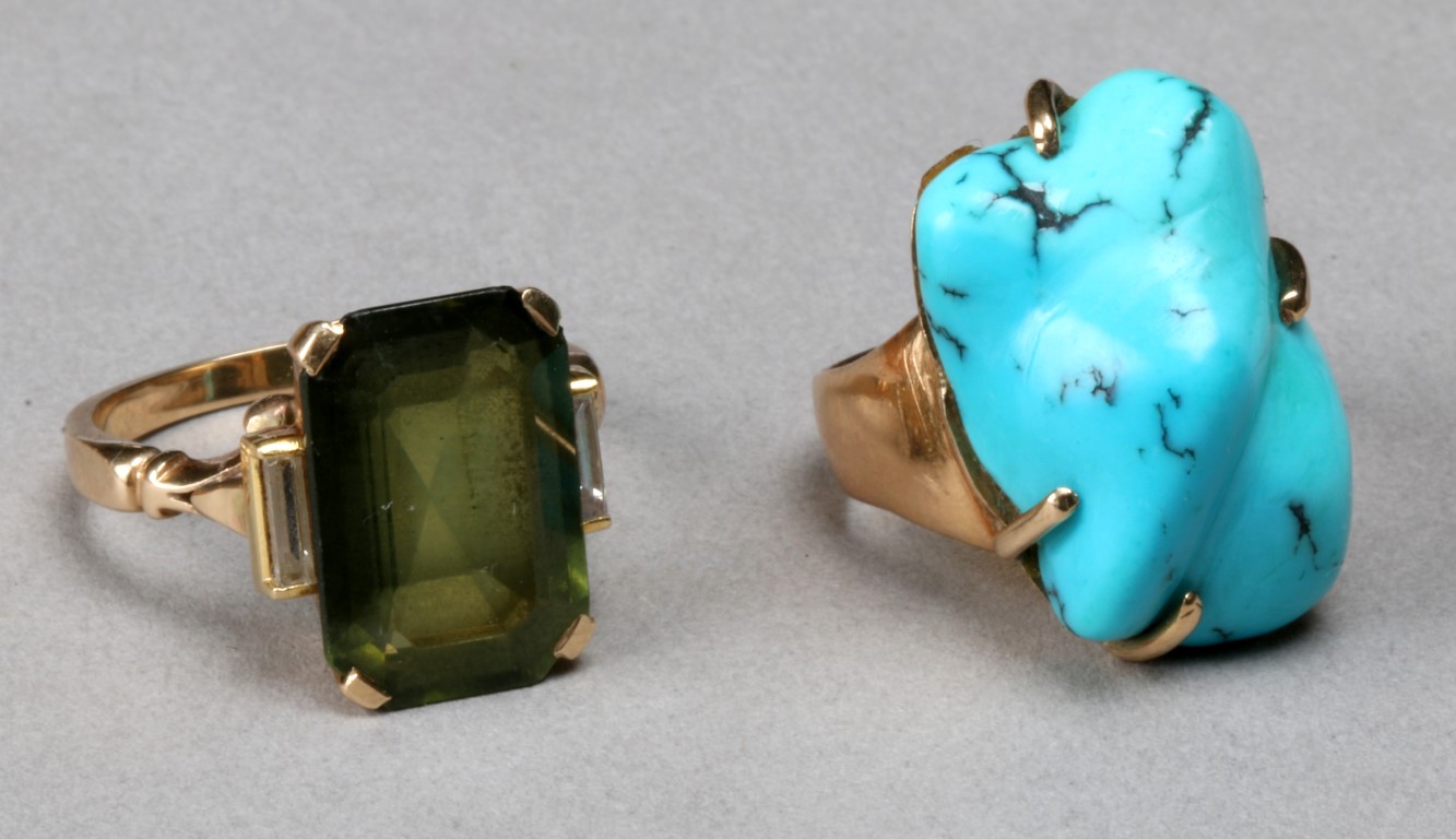 A CONTEMPORARY TURQUOISE SET RING, baroque shaped stone set with claws and a tourmaline and