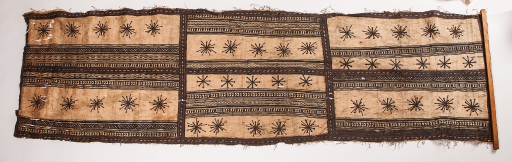 A FIJI TAPA CLOTH on a rectangular panel with horizontal banding and star decoration, 231 x 71cm