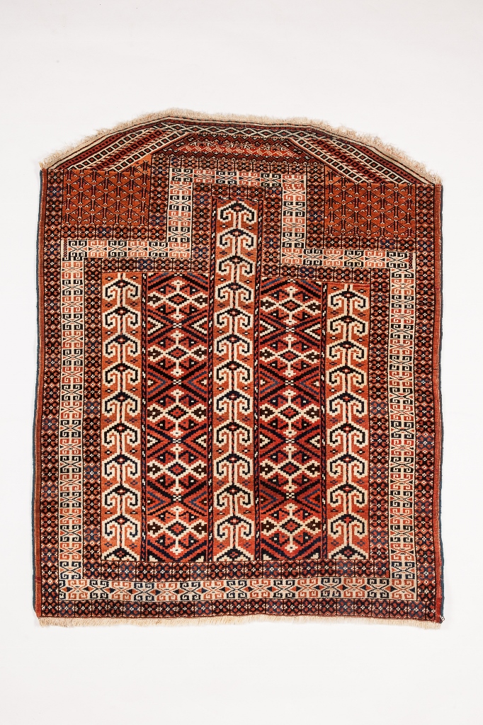 A YOMUT SALACHAK with three vertical hooked panels within a geometric field, 122 x 98cm overall