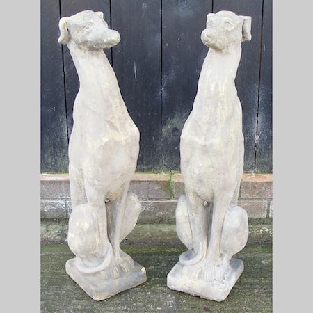 A pair of reconstituted stone greyhounds, 75cm tall