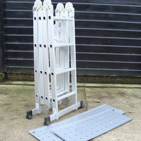 A multi purpose folding ladder, with scaffold plates