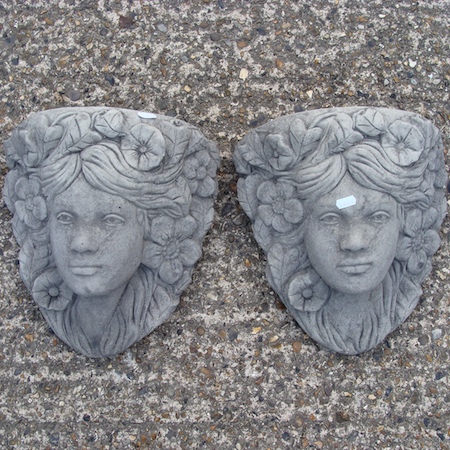 A pair of reconstituted stone wall pockets, 32cm tall