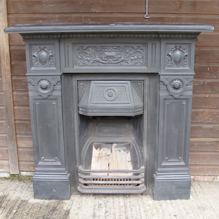 An Edwardian cast iron fire place, 123cm