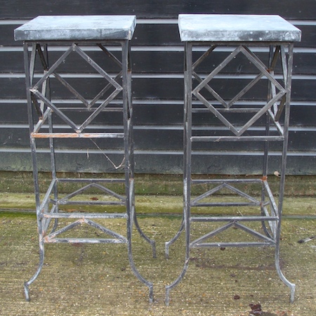 A pair of metal framed plant stands, 106cm tall