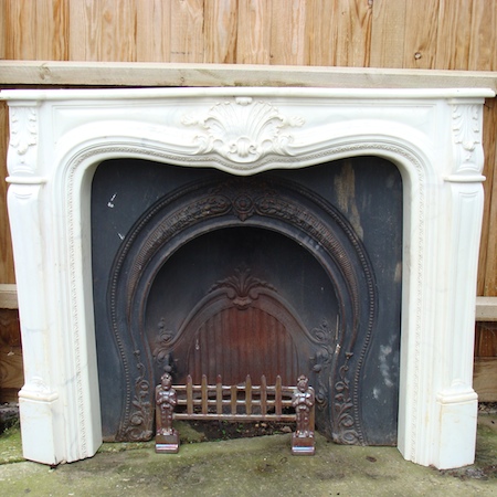 A cast iron fire insert, with a marble effect surround, 136cm