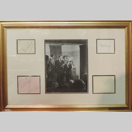 A framed photograph of the cast of The Goon Show, together with autographs of Spike Milligan,