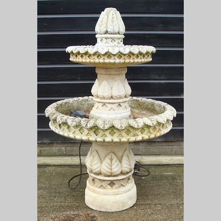 A reconstituted stone two tier water fountain, approximately 130cm tall