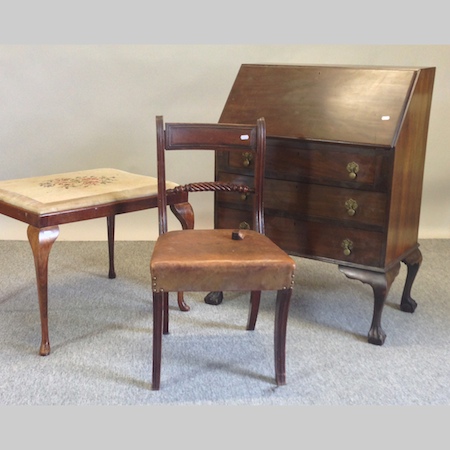 A 1920's mahogany bureau, together with a Regency chair and a 1920's footstool