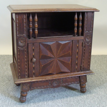 A 1920's French oak armoire, together with a matching bedside cabinet