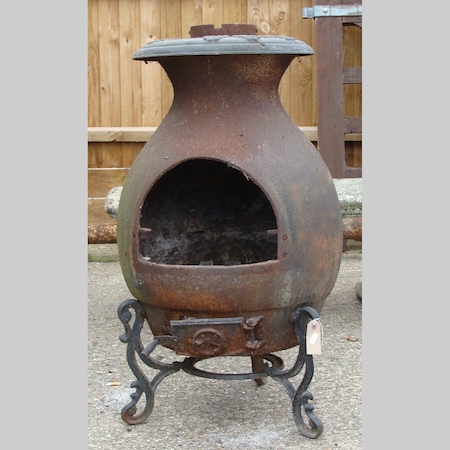 A cast iron chiminea, 85cm tall