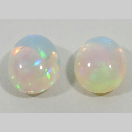 An unmounted opal, together with another, approx 4.44 carats