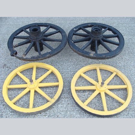 Two pairs of painted wooden cartwheels