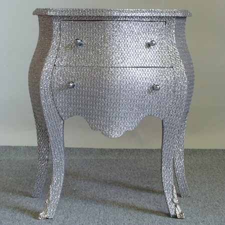 A silver glitter serpentine chest, 64cm
