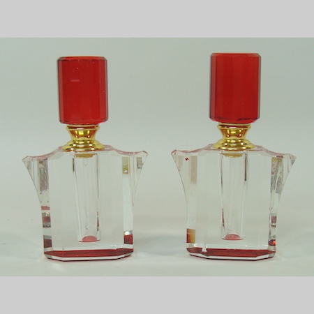 A pair of coloured glass scent bottles, 11cm tall