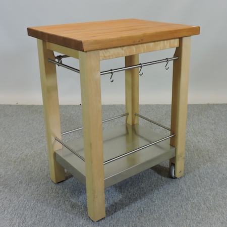 A maple and stainless steel butcher's block, on castors, 65cm