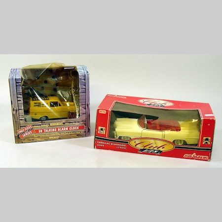An Only Fools and Horses clock, together with a tinplate toy cadillac