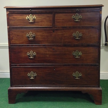 A George III mahogany chest, with a brushing slide, on bracket feet, 104cm