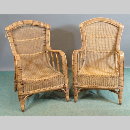 A pair of rattan armchairs