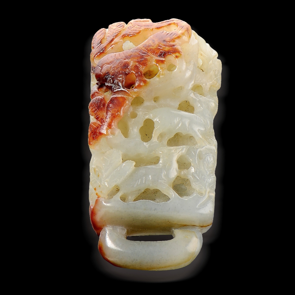 A FINELY CARVED WHITE AND RUSSET JADE TIGER FITTING BETWEEN LIAO AND JIN DYNASTY (907-1234) L 6.7