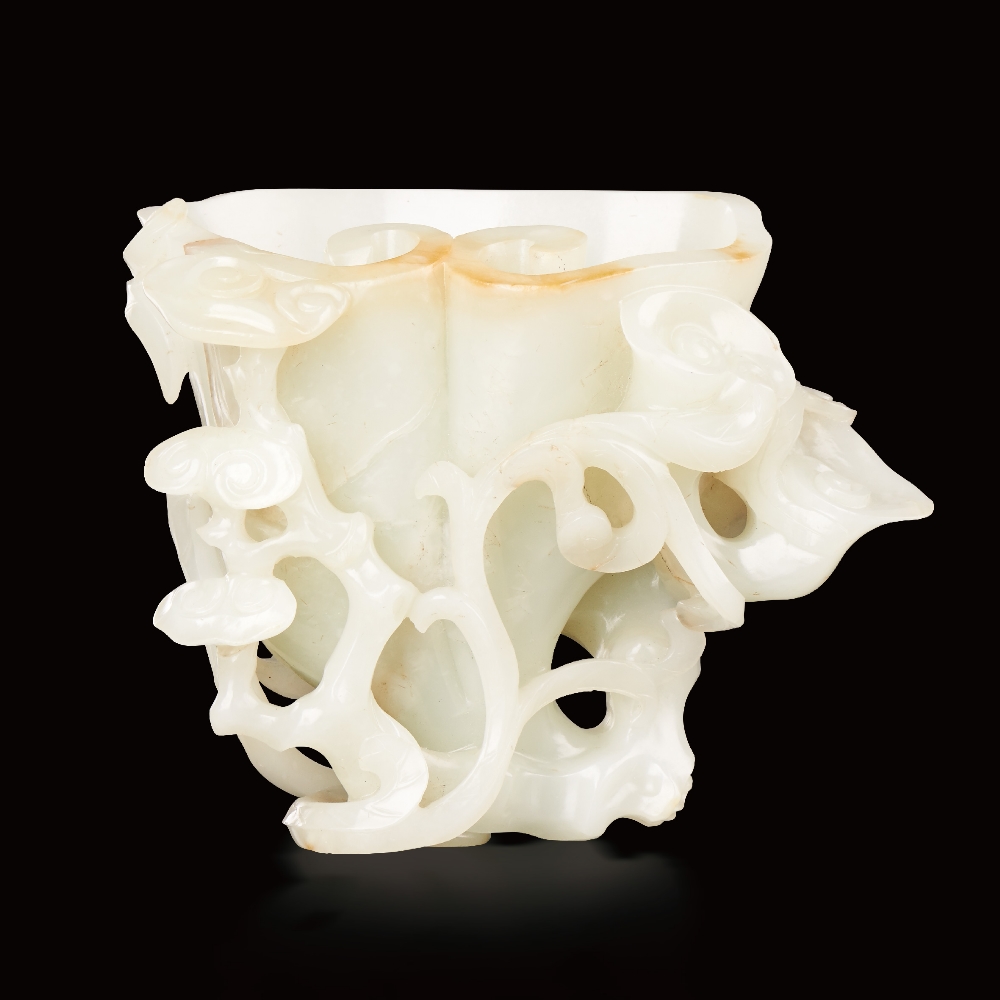 AN IMPERIALLY INSCRIBED WHITE JADE `JIURU` VASE QIANLONG PERIOD (1736-1795) H 14 cm. (5 1/2 in.) L