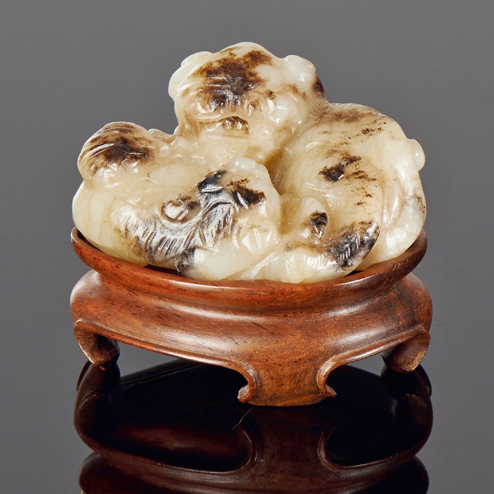 A BURNT JADE `LION AND CUB GROUP` PENDANT MING DYNASTY (1368-1644) L 5.1 cm. (2 in.) ? ???????????