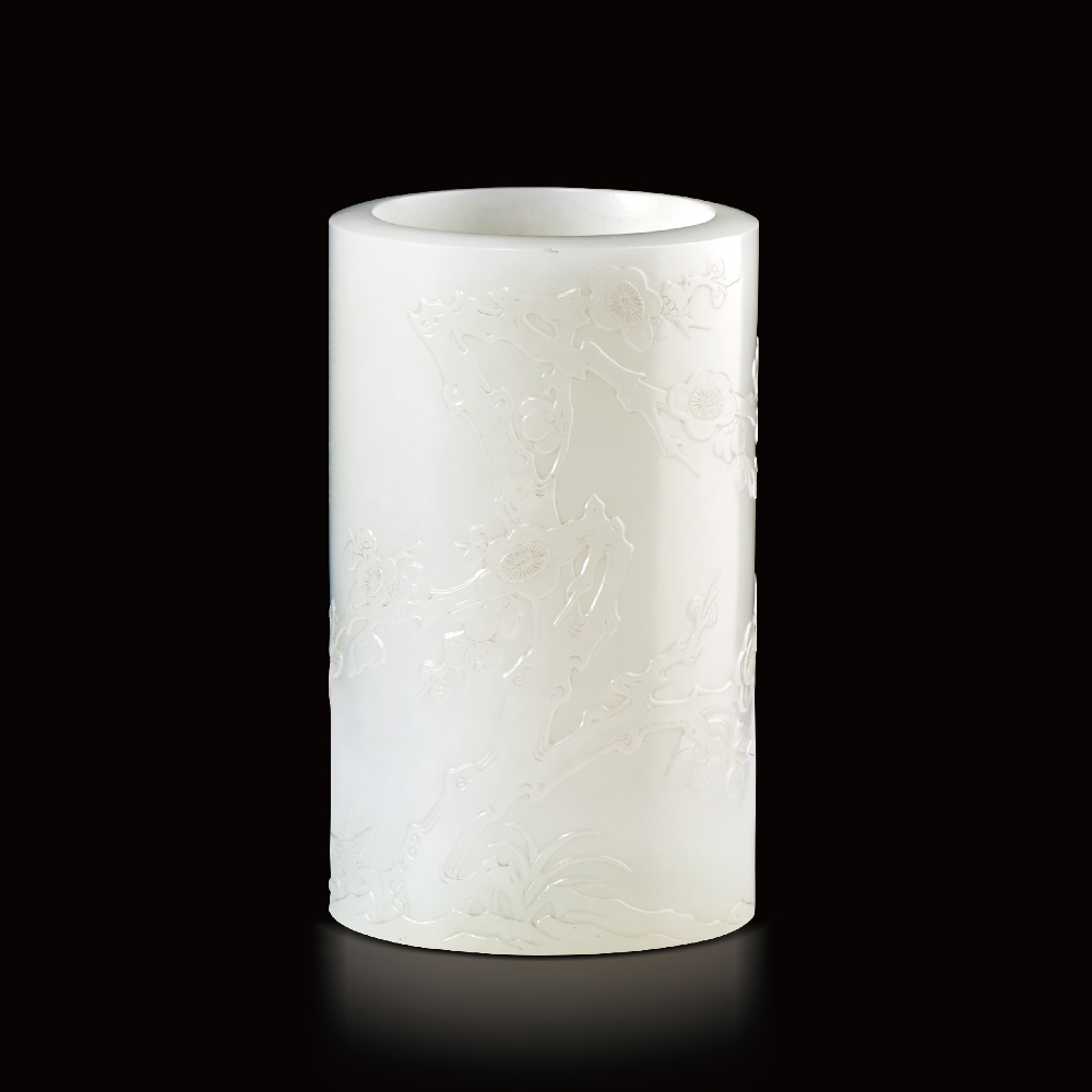 AN IMPERIALLY INSCRIBED WHITE JADE `PRUNUS` BRUSHPOT, BITONG QIANLONG PERIOD (1736-1795) `HUI XIN BU