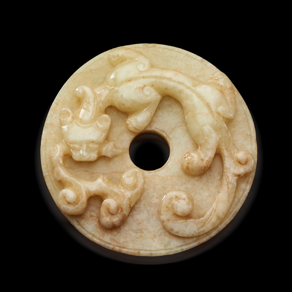 A YELLOW JADE `CHI DRAGON` DISC, BI QING DYNASTY (1644-1911) D 5.4 cm. (2 1/4 in.) ? ???????