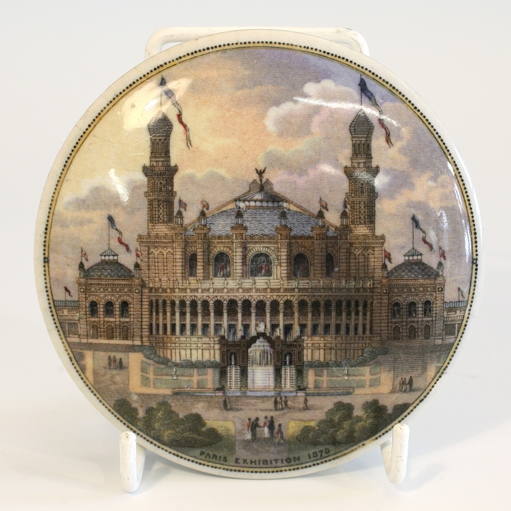 A Prattware pot lid `Paris Exhibition 1878`. a 19th century pot lid depicting the Paris Exhibition