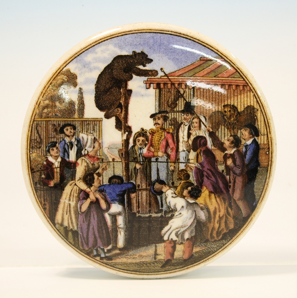 A Prattware pot lid `The Bear Pit` mid 19th century, depicting a bear on a pole (without dome),