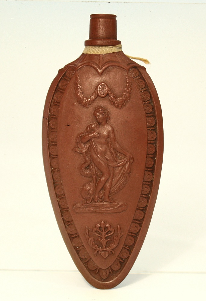 A Victorian terracotta scent bottle teardrop form, with relief decoration depicting classical